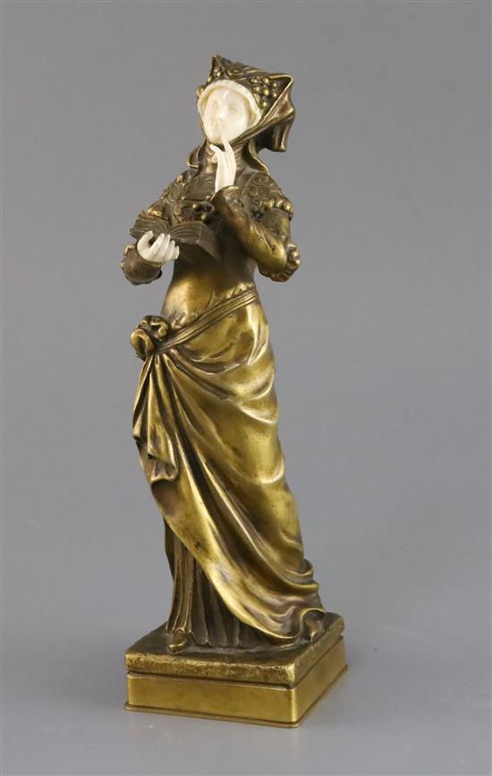 Eugene Bernoud (19th C.). A bronze and ivory figure of La Liseuse, 10.25in.